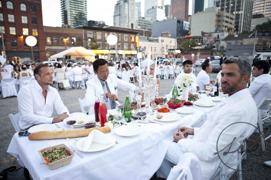 Participants enjoy their food and drinks at Diner En Blanc Toronto