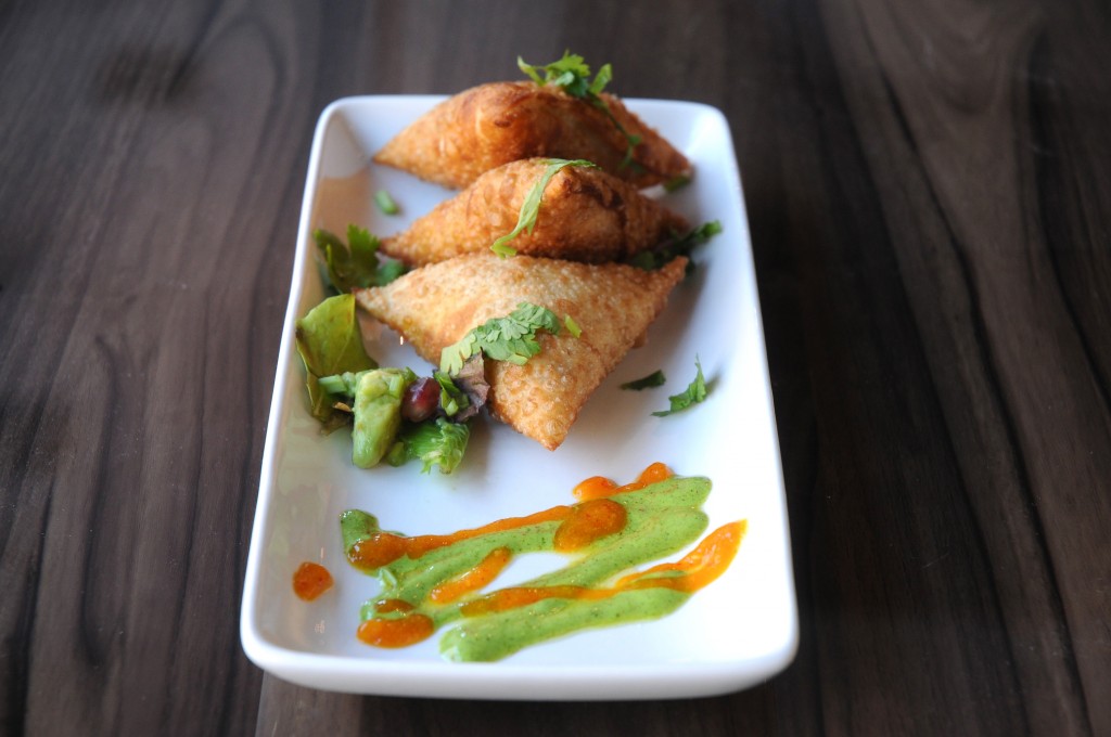 Vegetable Samosa - crisp pastry filled with potatoes, peas and spices, served with tamarind chutney. Photo c/o Bindia.